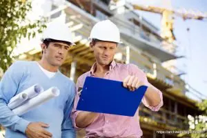 Male architects with blueprint and clipboard working at site - Architecture GOLN [ en.architecture.gurukul.edu.bd ]