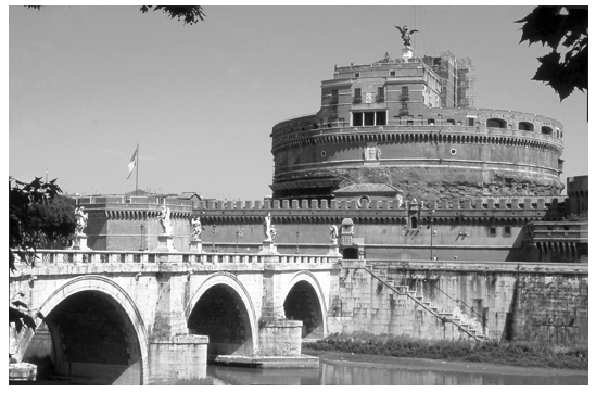 Figure 8.25  Rome, Mausoleum of Hadrian (Castel St. Angelo) completed in ad 140. In the foreground is the bridge, the Pons Aelius (Ponte St. Angelo), inaugurated in ad 134.